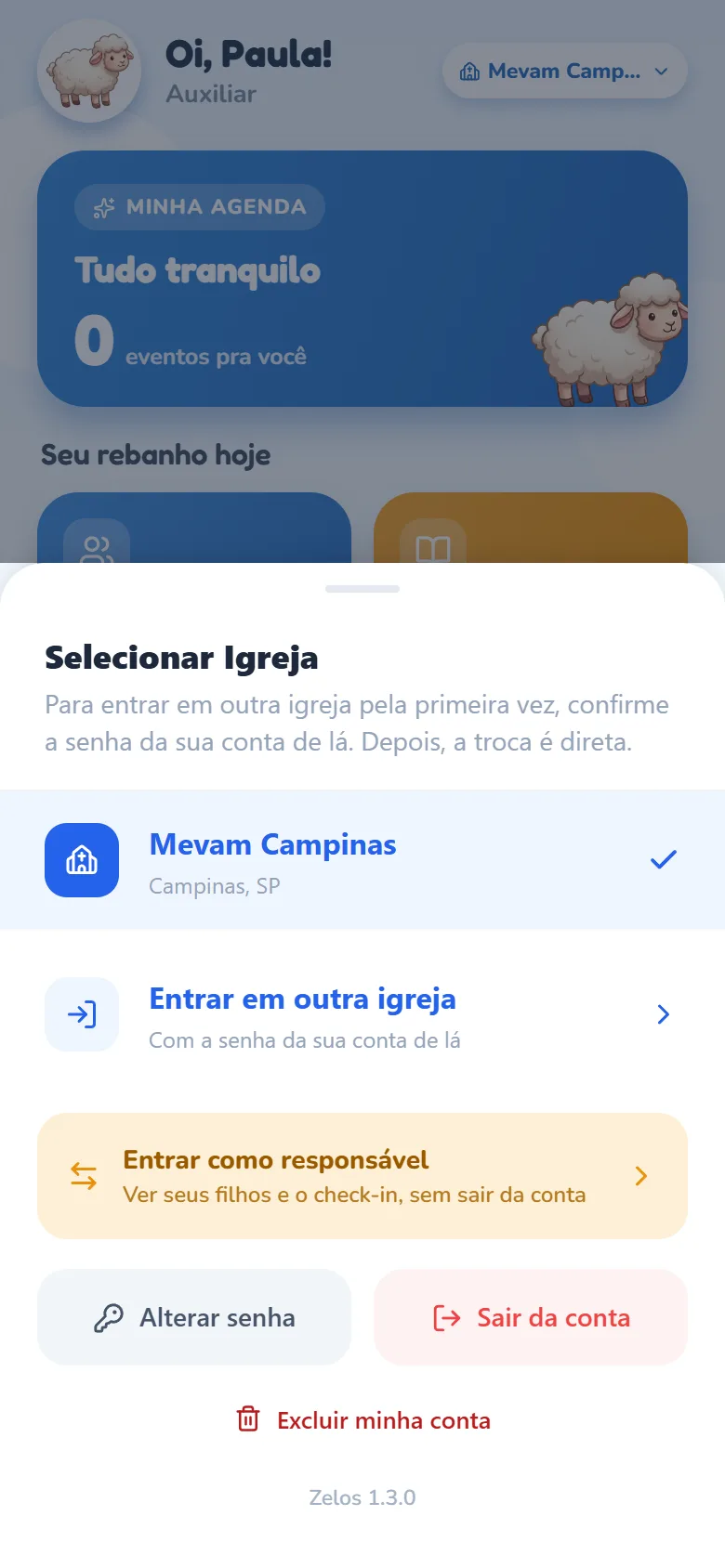 Folha Selecionar Igreja aberta pelo chip do Início (atrás, Oi, Paula! com Auxiliar embaixo), com o texto Para entrar em outra igreja pela primeira vez, confirme a senha da sua conta de lá. Depois, a troca é direta., a igreja Mevam Campinas marcada, a linha Entrar em outra igreja (Com a senha da sua conta de lá), o card laranja Entrar como responsável, os botões Alterar senha e Sair da conta e o link Excluir minha conta.